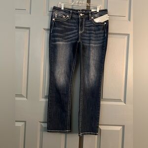 Miss Me Mid-Rise straight jeans.